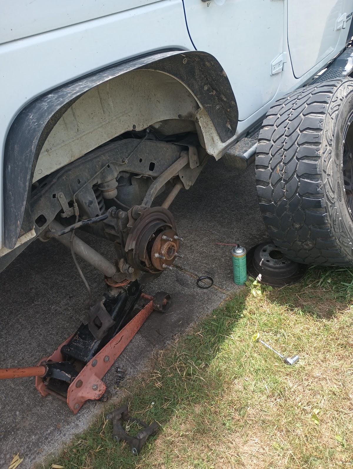 Wheel removed from a vehicle in a photo on Jarrett’s Google profile